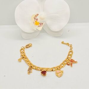 NWOT, Juicy Couture Gold Tone Multi Charm Bracelet 7”